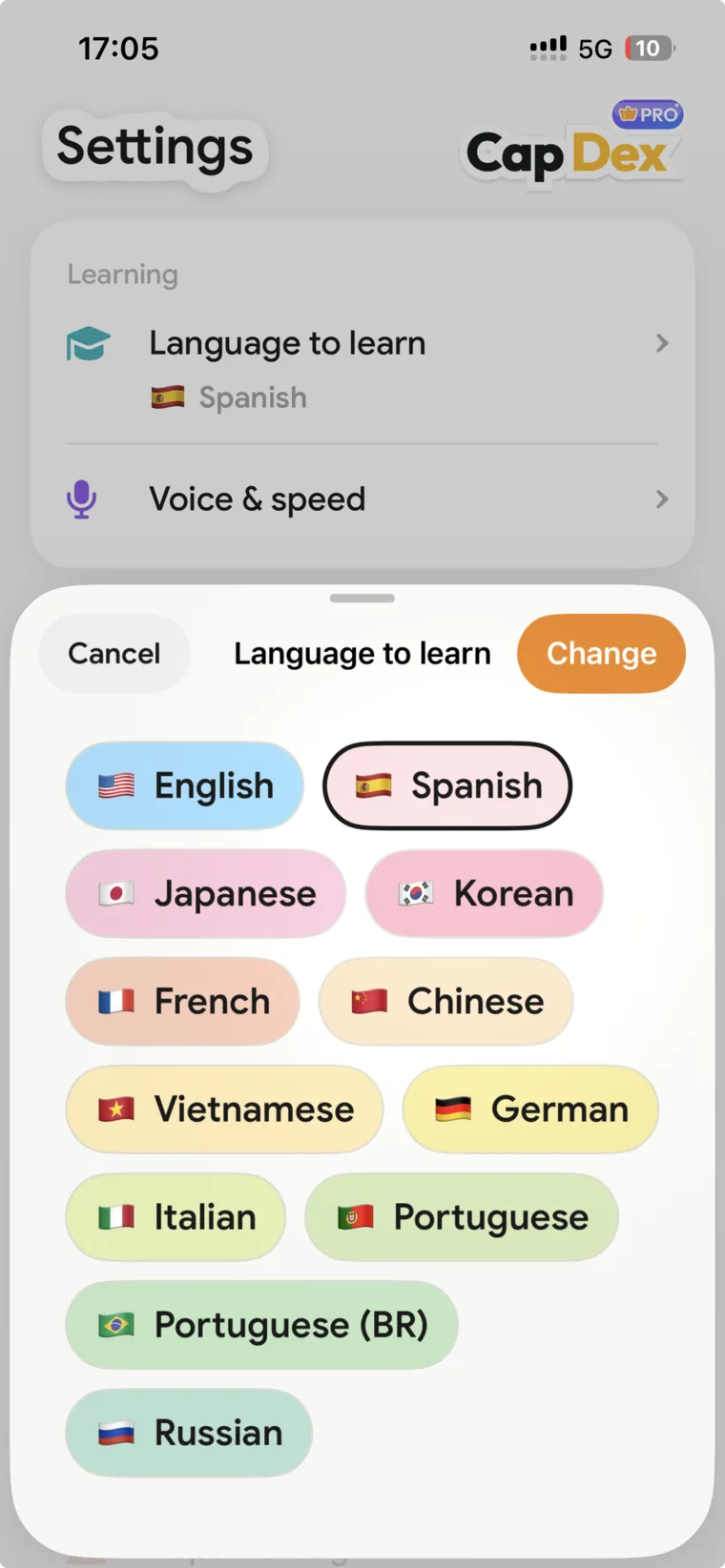 CapDex Settings with the Language to learn sheet open: English, Spanish, Japanese, Korean, French, Chinese, Vietnamese, German, Italian, Portuguese, Portuguese (BR) and Russian, each with its flag.