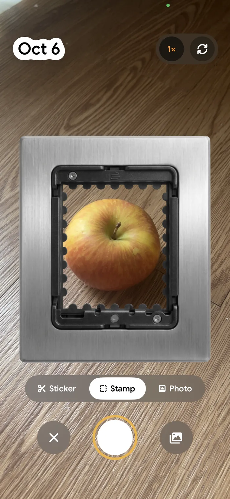 The CapDex camera in Stamp mode: an apple inside a perforated postage-stamp frame, with Stamp selected.